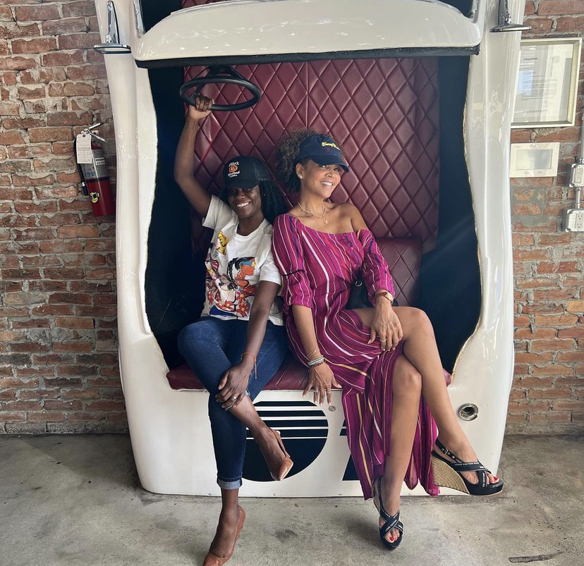 a couple of guests in a fancy booth at the Tito's Vodka event.