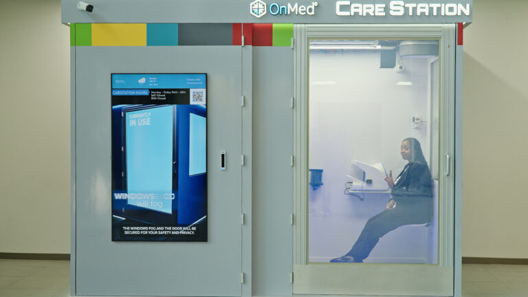 a woman visits with a doctor in the OnMed Care Station at OYC Miami