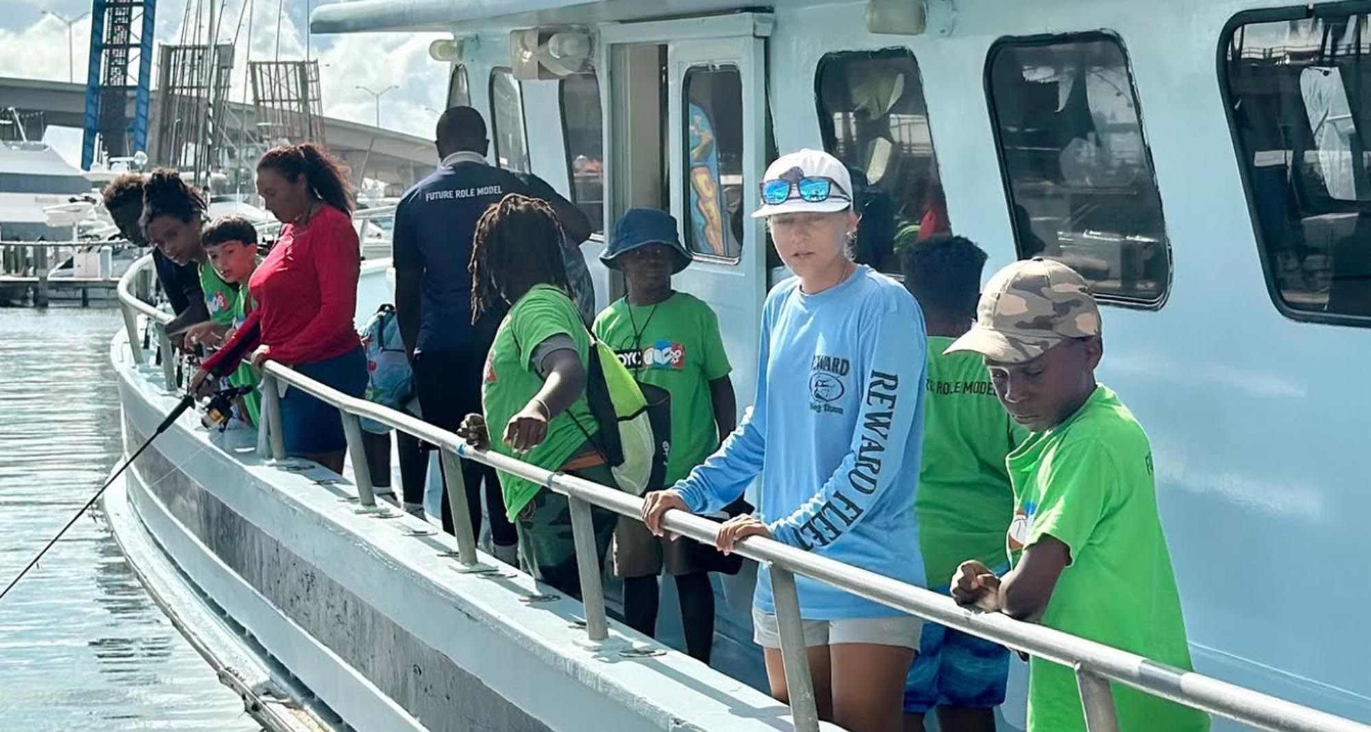 a group of people on a fishing charter boat