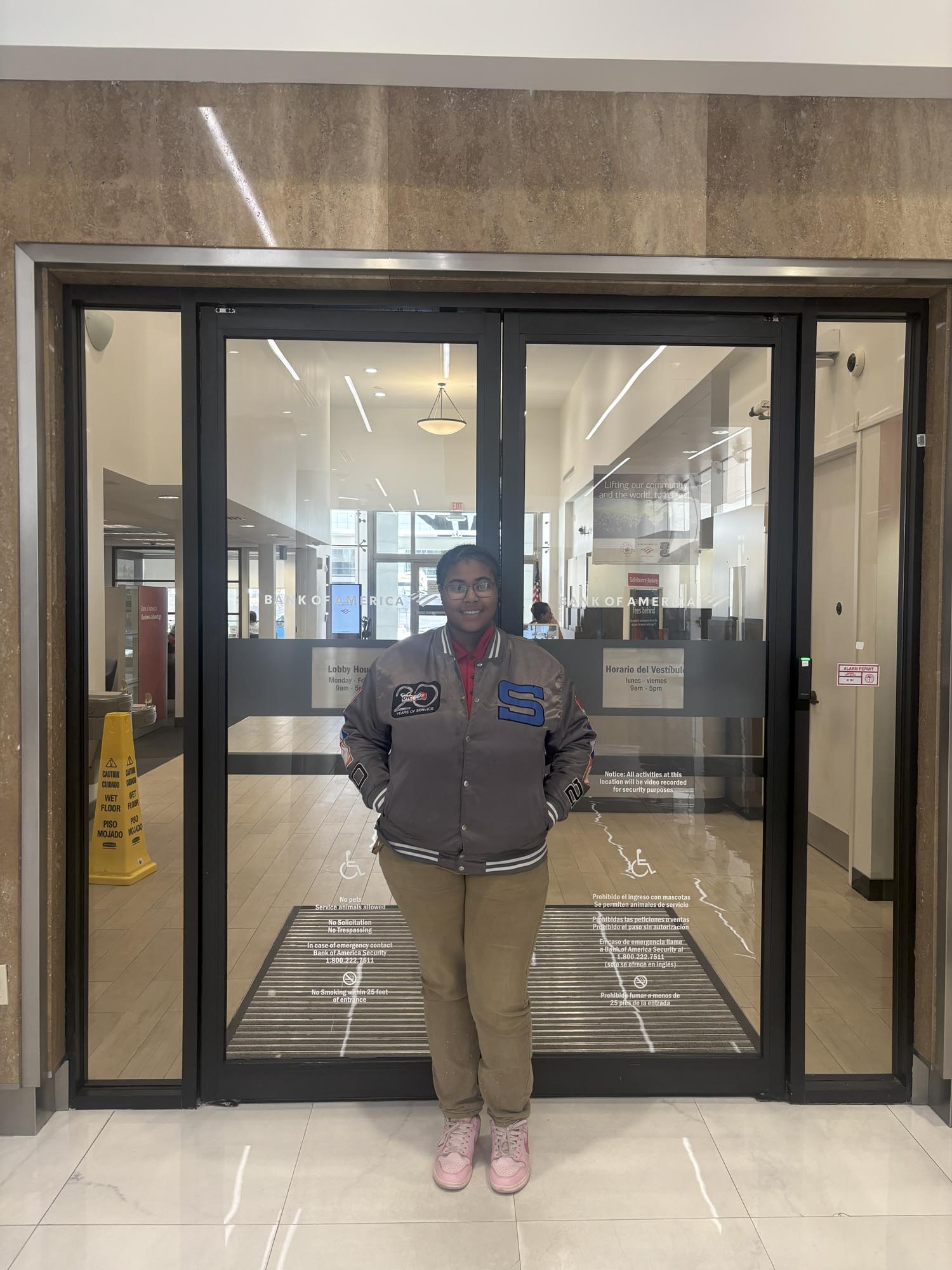 a summer intern stands in front of a business