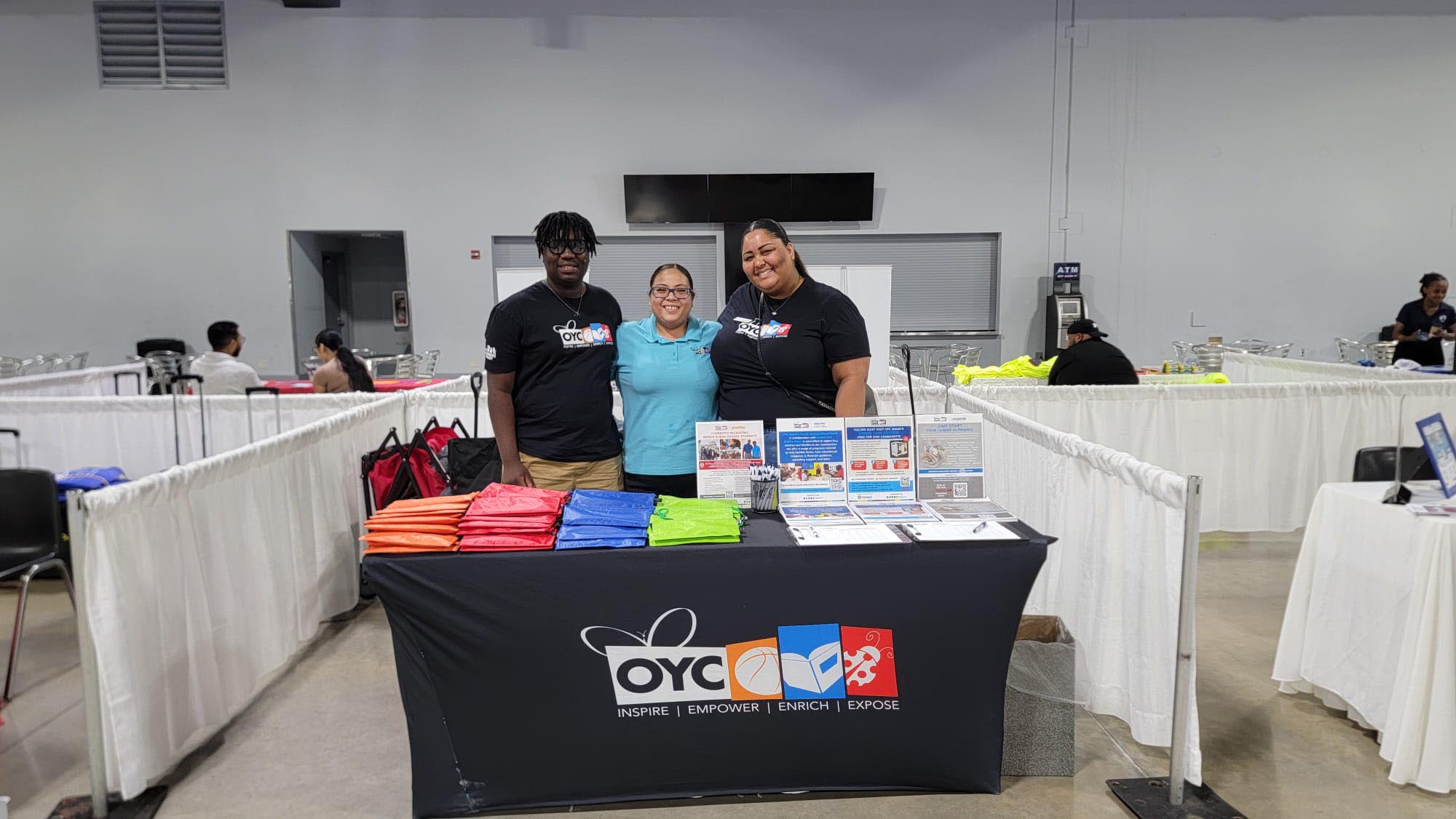 An OYC promotional table with swag