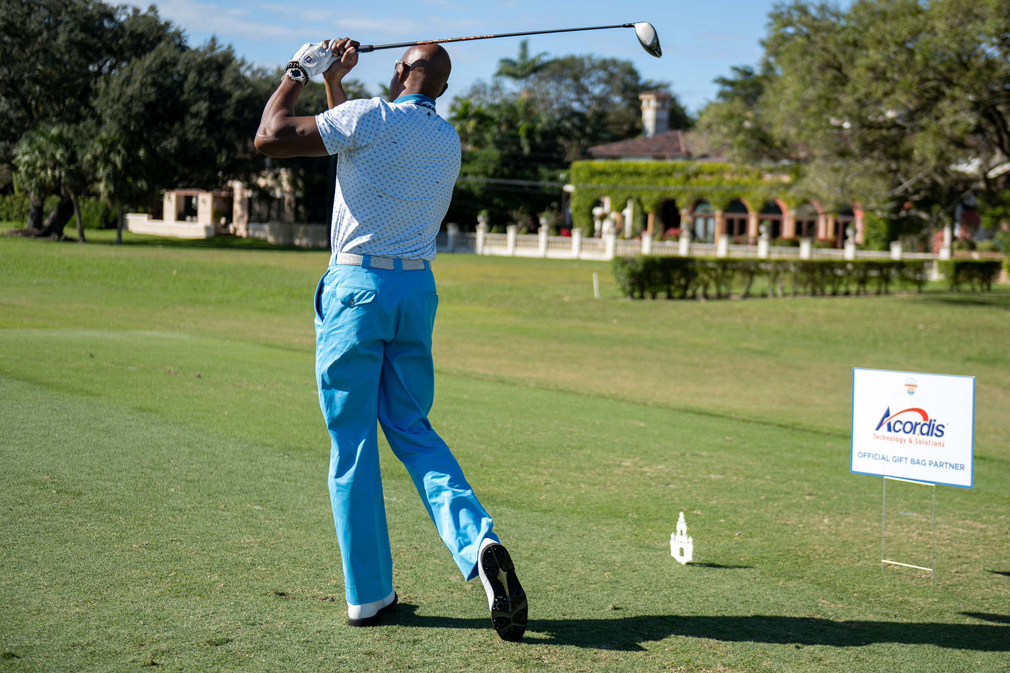 Alonzo Mourning tees off at the Biltmore Golf Course
