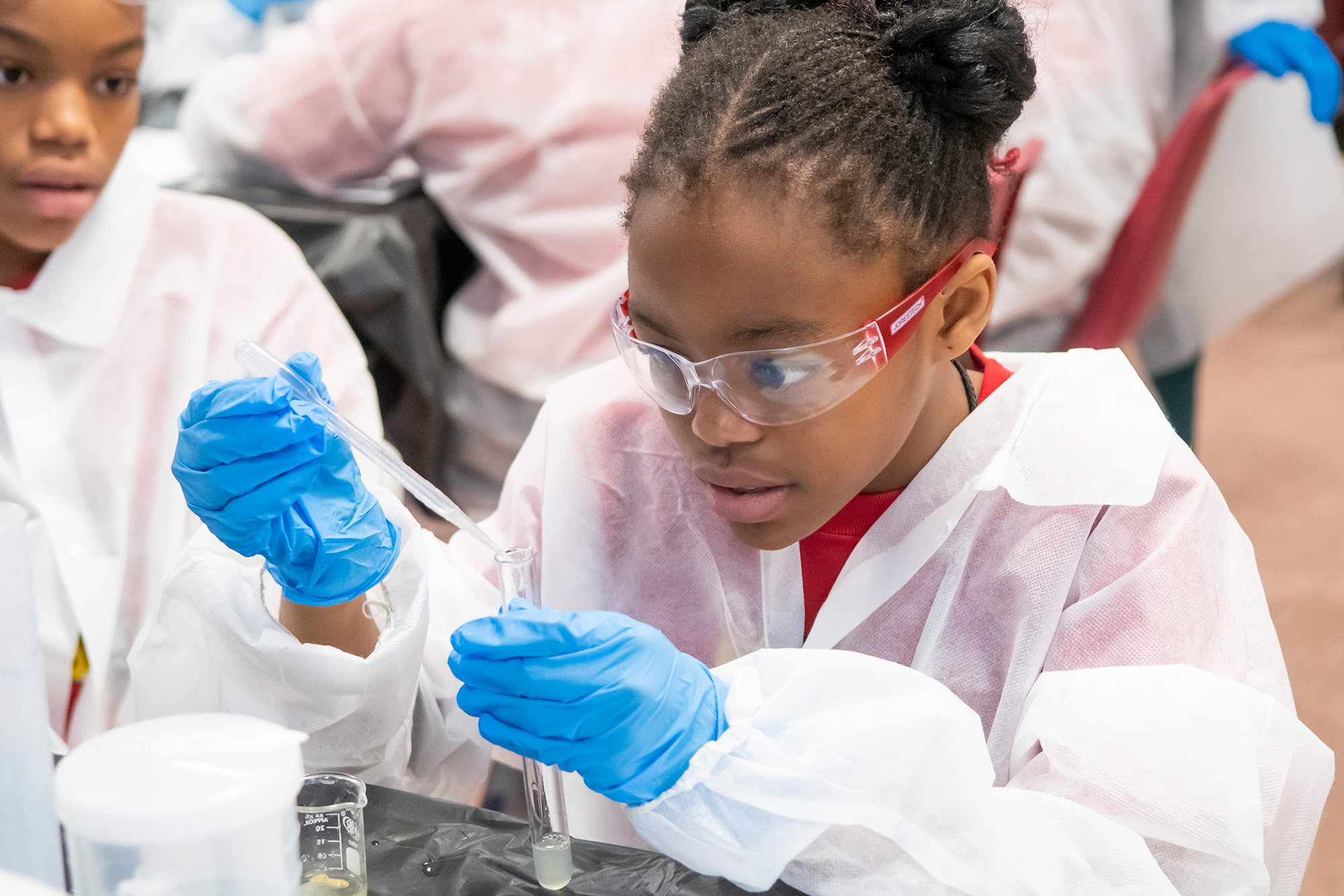 girl-with-test-tube_stem-programs_2000x1333