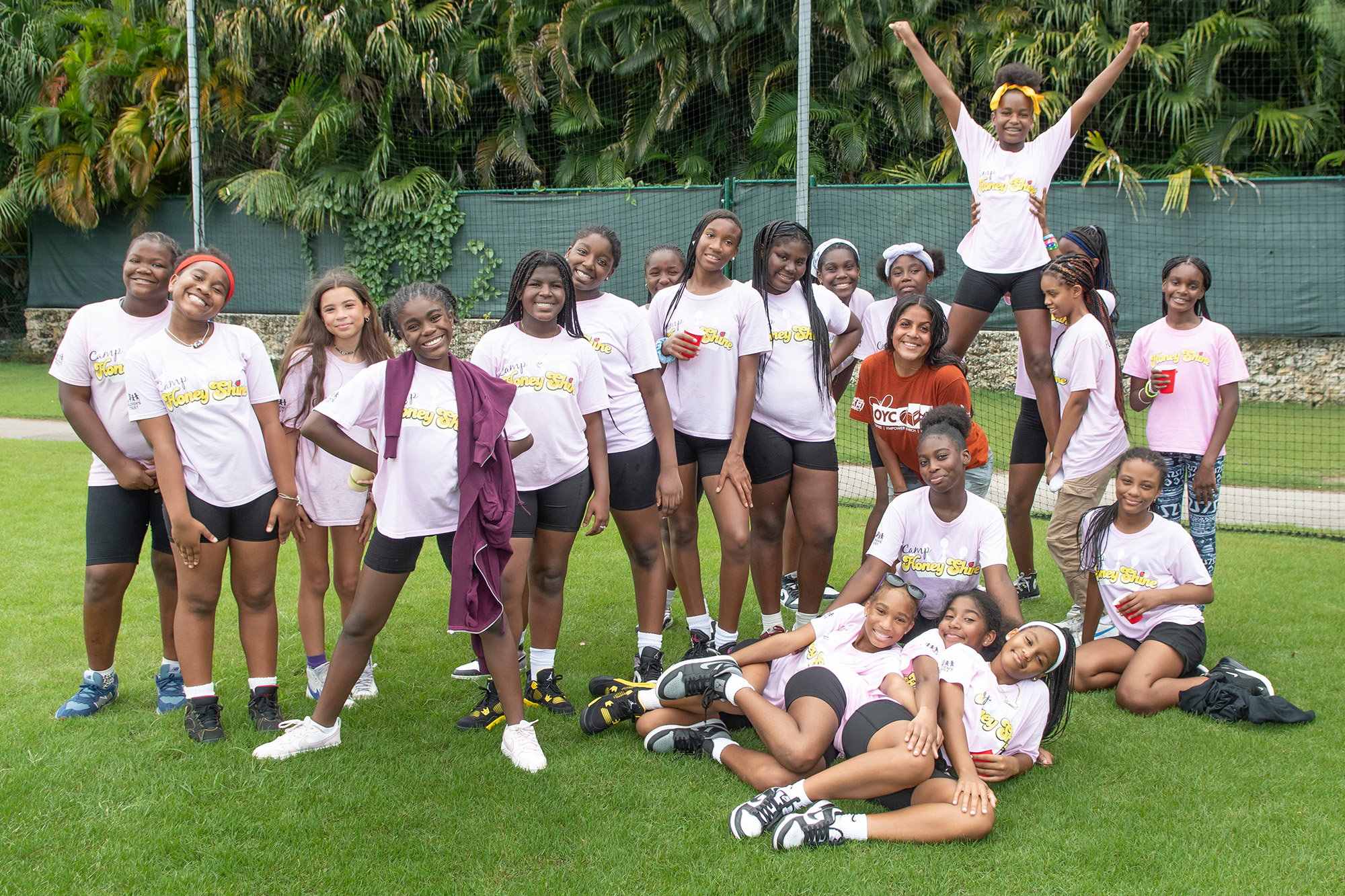 a girls team stands together on a field