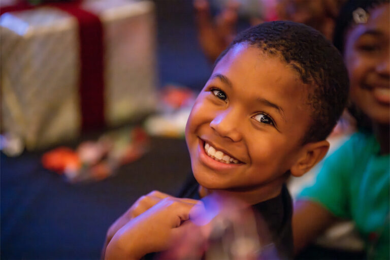 a young boy smiles for the photo