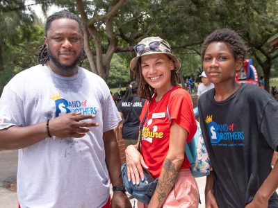 OYC staff members and a young male participant